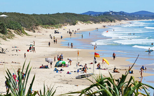 coolum beach sunbathing